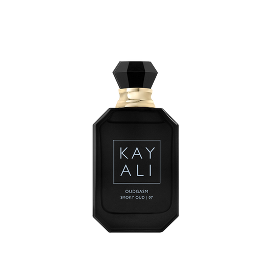 Black perfume bottle with gold cap on a white background
