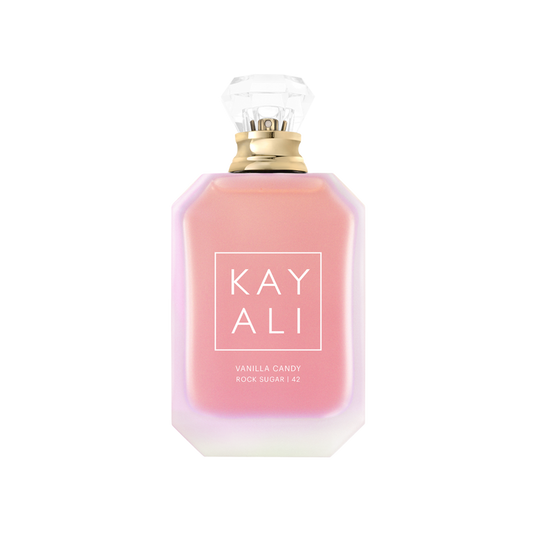 Pink perfume bottle with gold cap on a white background